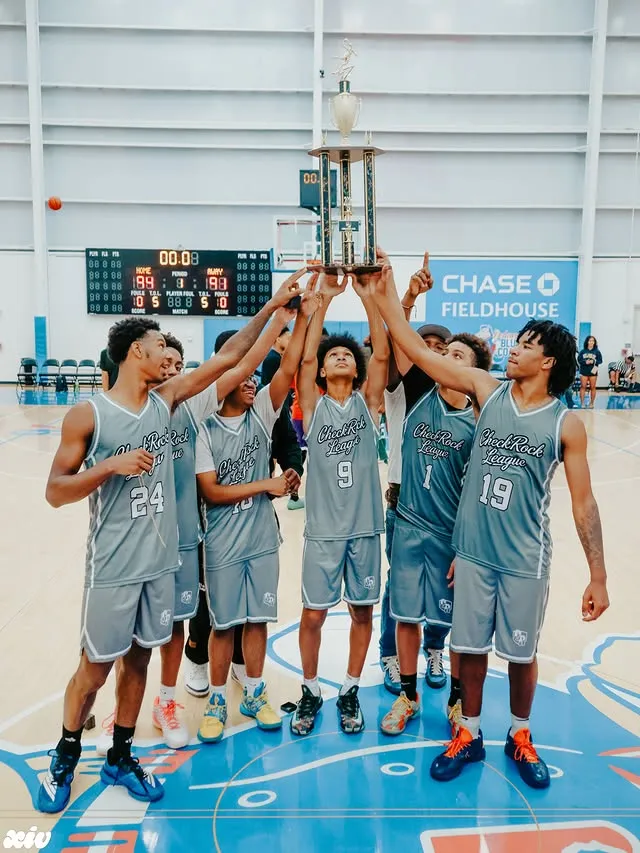 CheckRock League champions raising the trophy at Chase Fieldhouse