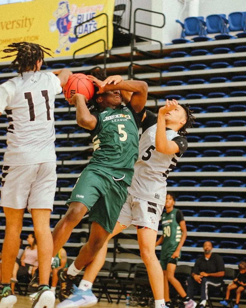 Players battling under the rim