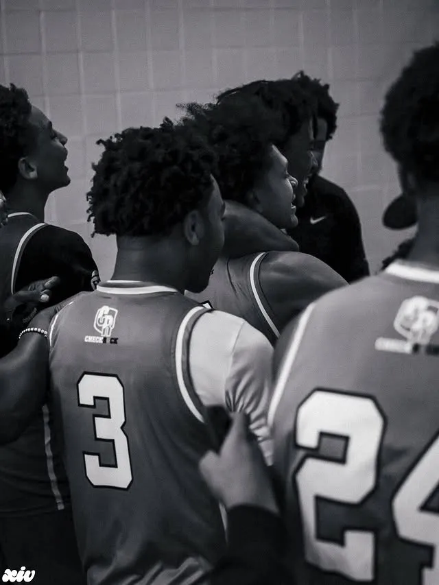 Team huddle in black and white