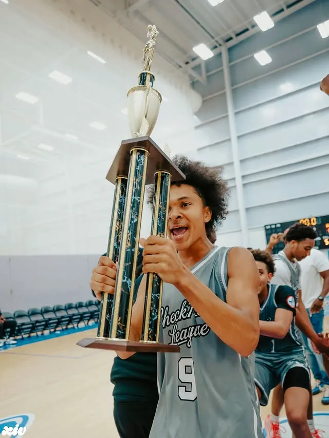 Player celebrating with the championship trophy